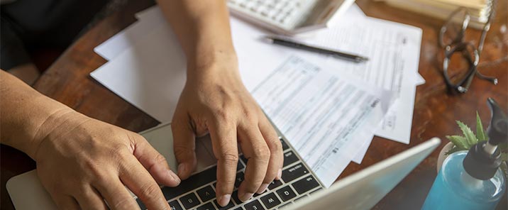 person typing on laptop